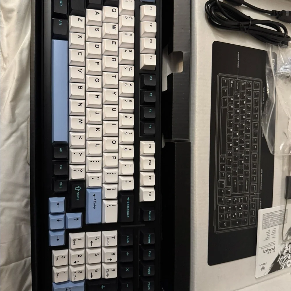 Sleek Black and White Mechanical Keyboard with Blue Accents